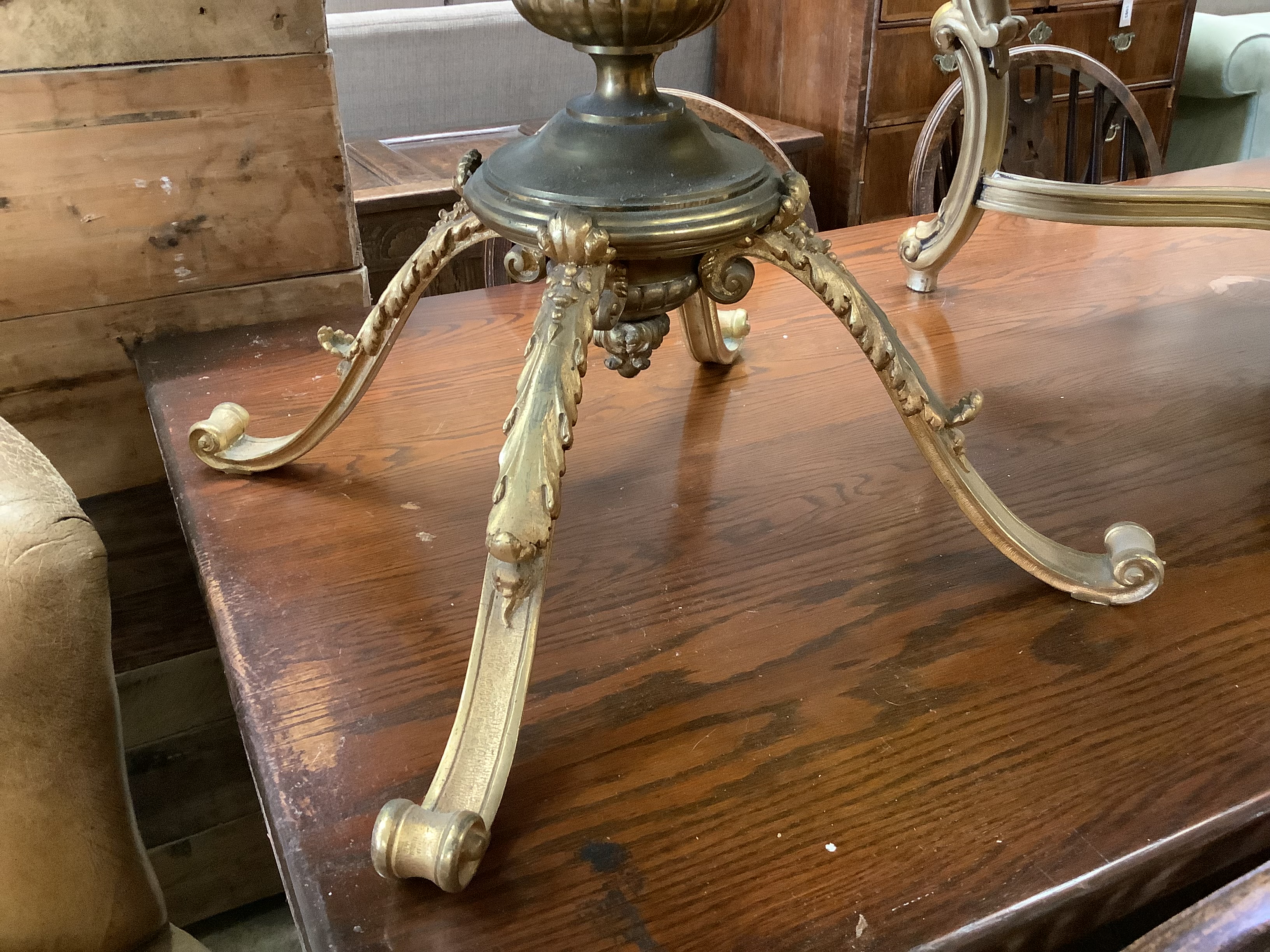 A circular gilt metal low coffee table with variegated marble top, diameter 62cm together with a larger faux marble coffee table